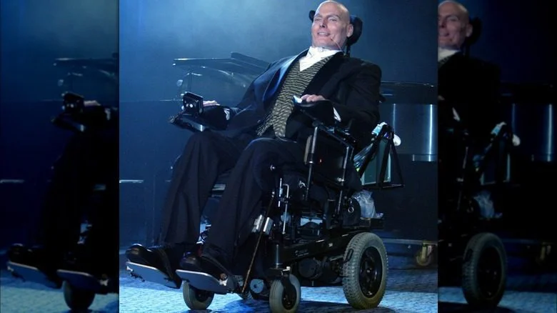 Christopher Reeve smiling suit wheelchair on stage