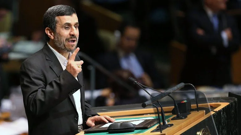 Mahmoud Ahmadinejad speaking at podium
