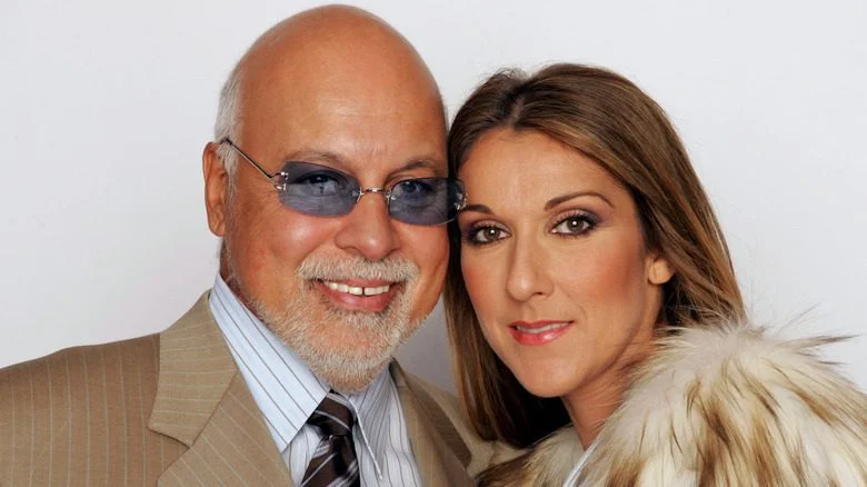 René Angélil et Céline Dion se touchant la tête