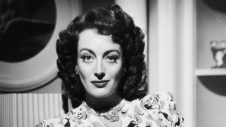 Joan Crawford with curls and lipstick