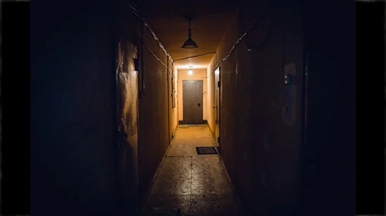 door at end of dark corridor