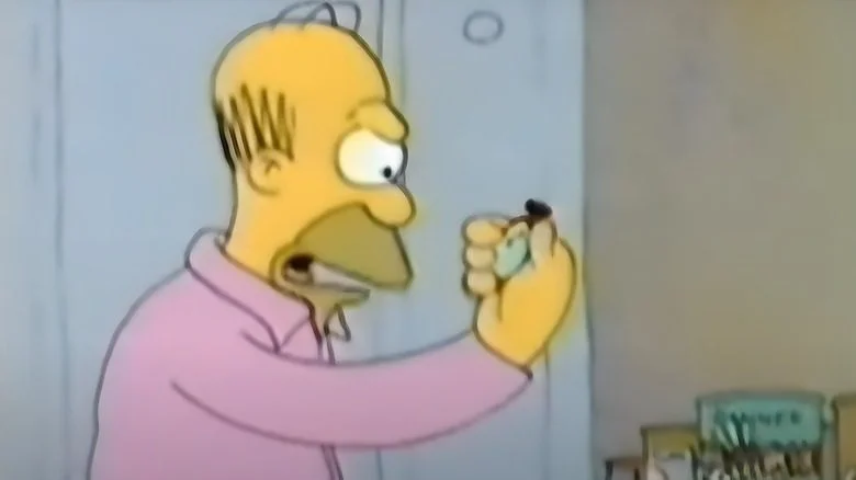 Homer regarde un chronomètre