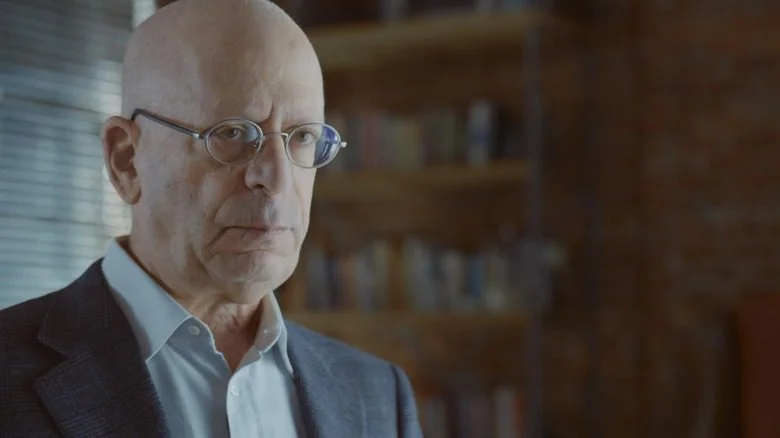 Shel Kaphan stern glasses suit