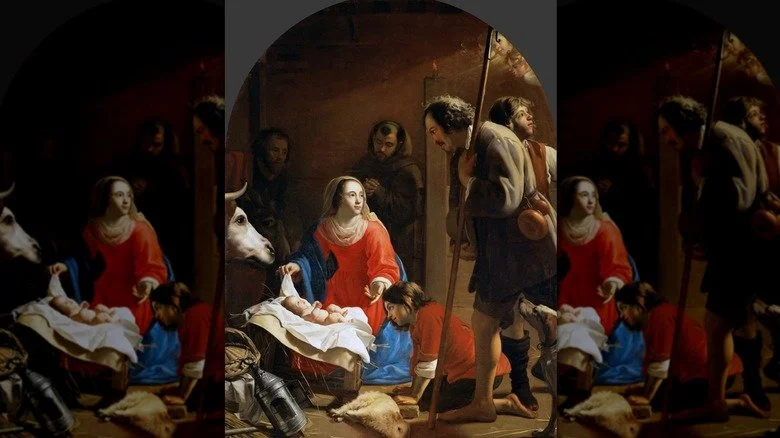 Marie ajuste les couvertures du bébé Jésus