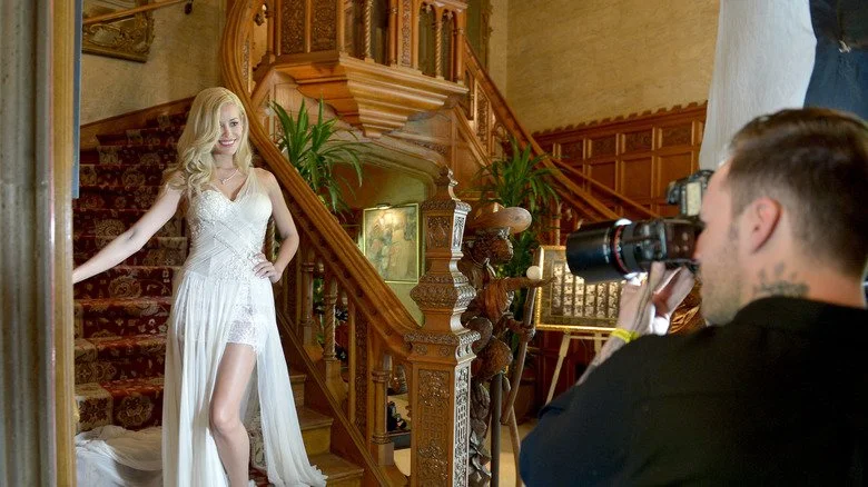 photographer taking a picture of the playmate of the year