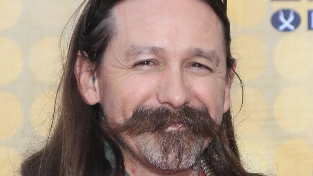 Oliver Peck : le Maître du Tattoo et son Record Étonnant