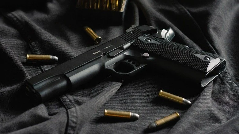 gun surrounded by bullets