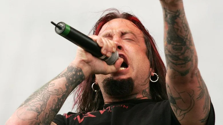 Drowning Pool's Jason 'Gong' Jones singing on stage