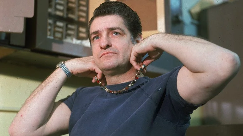 Albert DeSalvo holding necklace