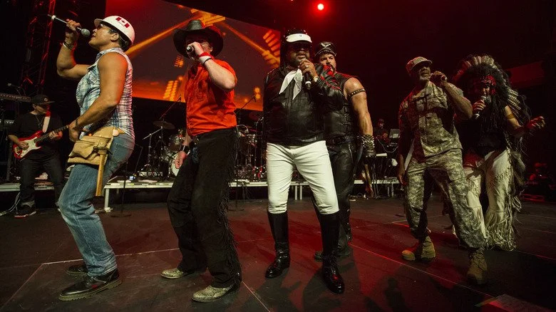 Village People dancing in formation