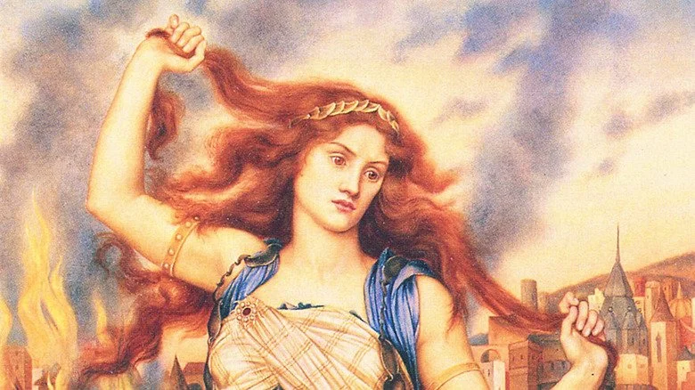 Une peinture de Cassandre devant la Troie en flammes