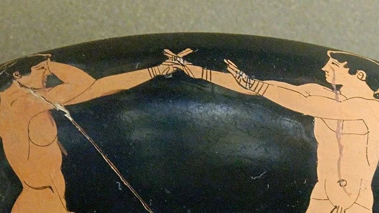 Deux jeunes grecs en train de boxer