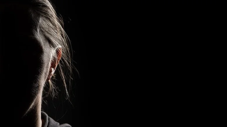 woman in the shadows