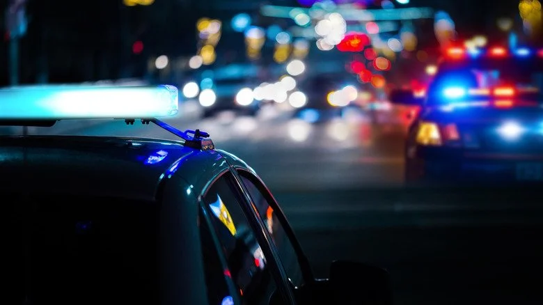 Police cars giving night chase