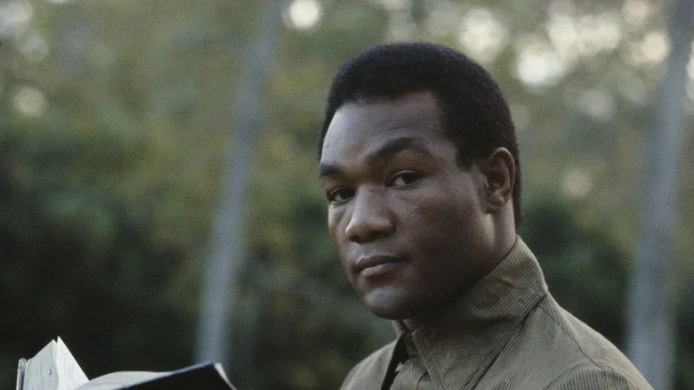 George Foreman reading the Bible in 1977