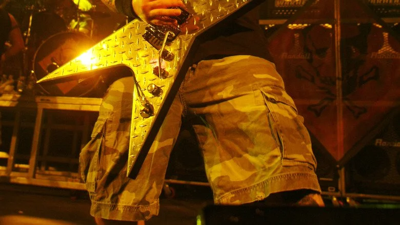 Damageplan's Dimebag Darrell playing his guitar at SOMA in 2004