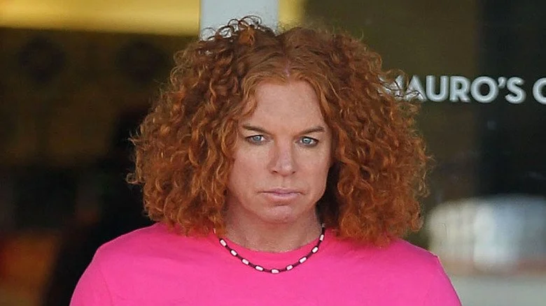 Carrot Top in pink shirt staring into camera