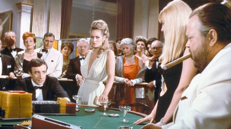 Peter Sellers and Orson Welles face off at a cards table