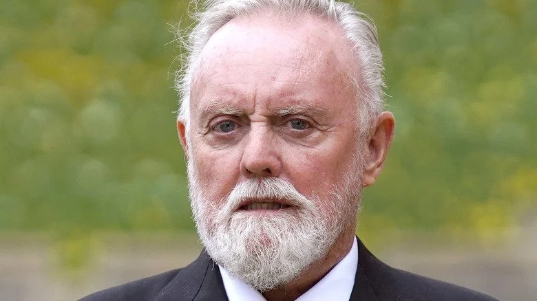 Roger Taylor lors de sa cérémonie OBE