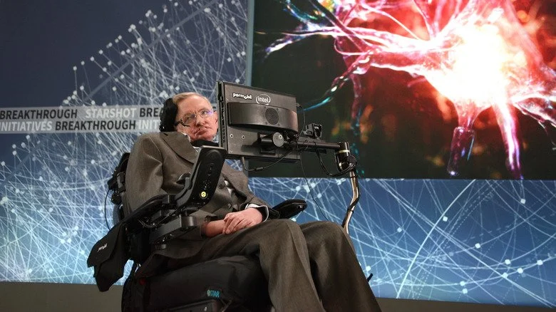 Stephen Hawking speaking onstage at a science conference