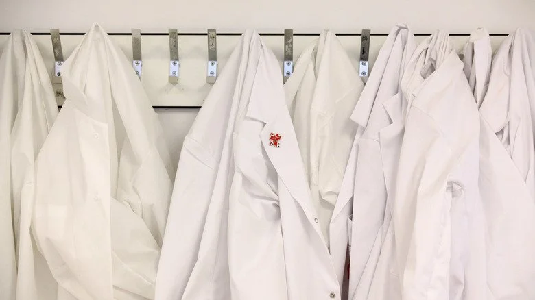 Lab coats on hooks