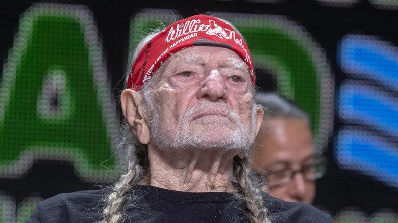 Willie Nelson in headband looking out