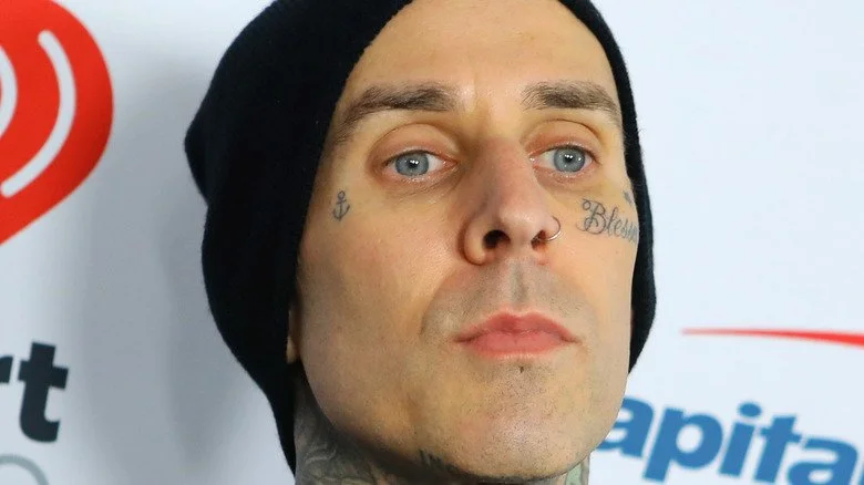 Travis Barker wearing a black hat