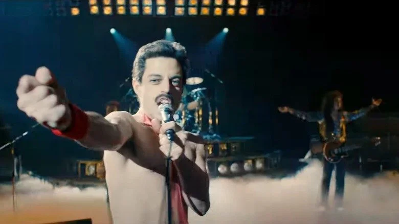 Rami Malek as Freddie Mercury performing onstage in Bohemian Rhapsody