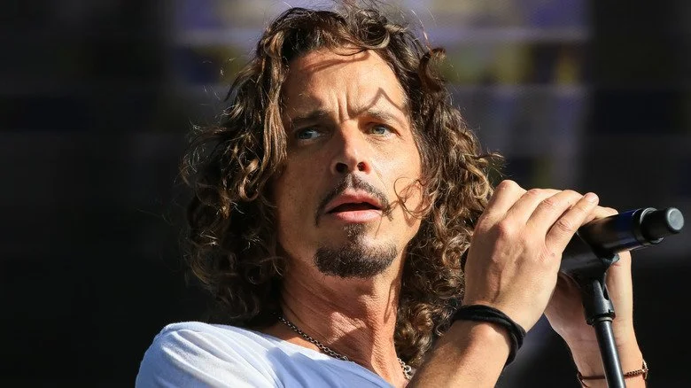 Chris Cornell holding mic on stage