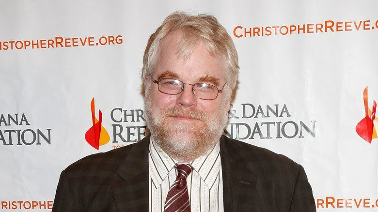 Philip Seymour Hoffman smirking in glasses