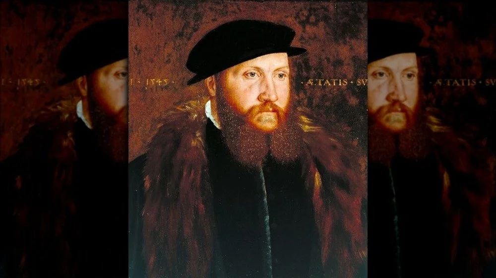 Portrait d'un homme portant une coiffe noire