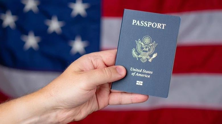 Person holding up U.S. passport