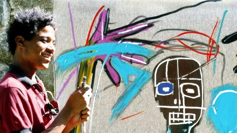 L'artiste Jean-Michel Basquiat peignant en 1983 à St. Moritz, Suisse