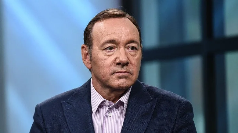 Kevin Spacey looking glum in a suit