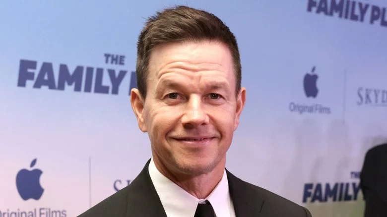 Mark Wahlberg closed mouth smile wearing suit