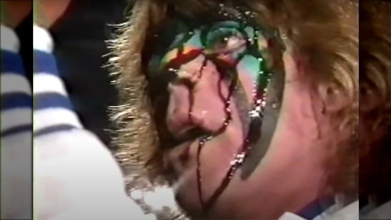 Papa Shango lançant un sort sur Ultimate Warrior