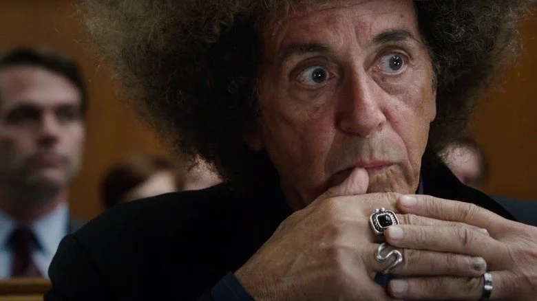 Al Pacino as Phil Spector wearing large wig in a courtroom scene from Phil Spector