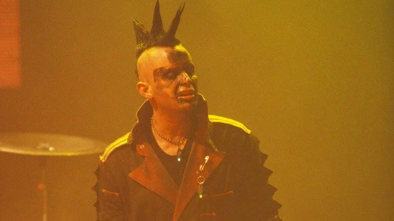 A mohawk-wearing Madonna Wayne Gacy on stage with Marilyn Manson