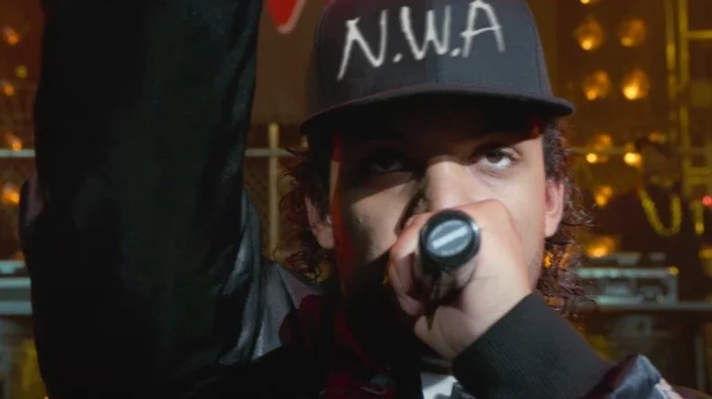 O'Shea Jackson Jr. as Ice Cube performing onstage in a scene from Straight Outta Compton