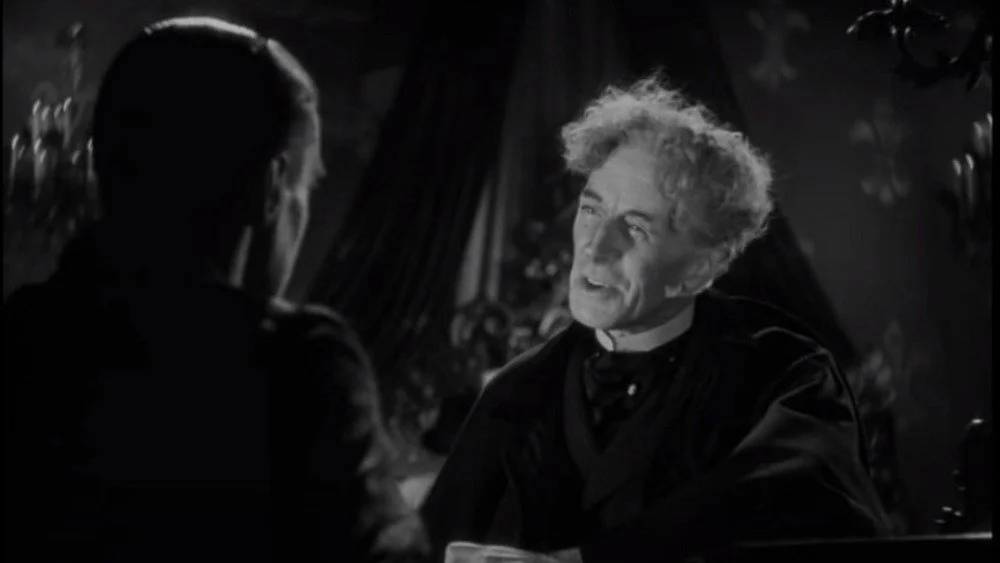 Colin Clive et Ernest Thesiger dans une scène d'échange