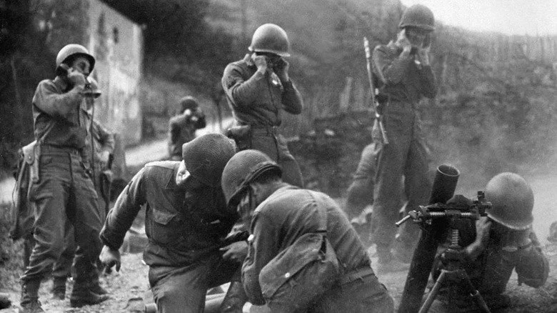 World War 2 artillerymen manning weapon