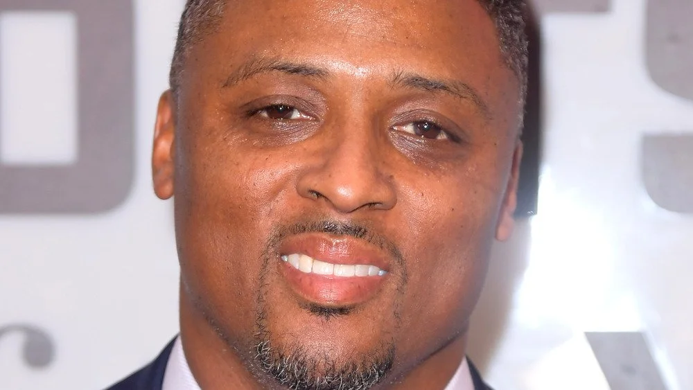 Warrick Dunn souriant