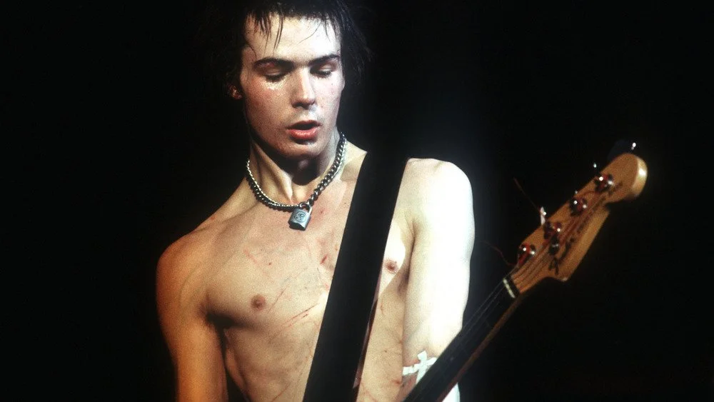 Sid Vicious jouant de la guitare