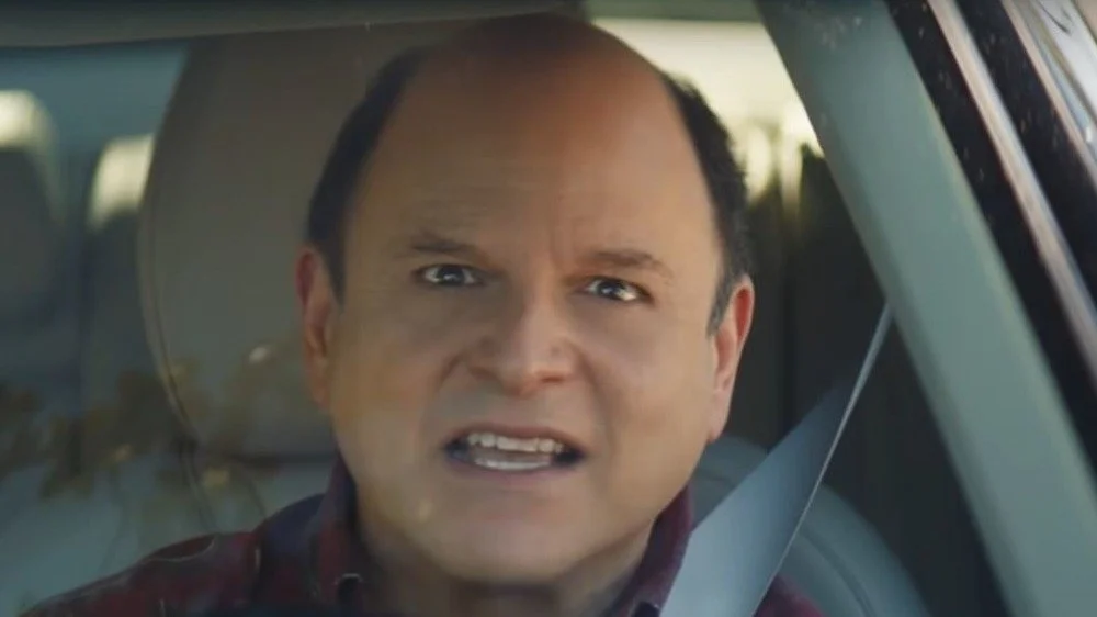 Jason Alexander conduisant