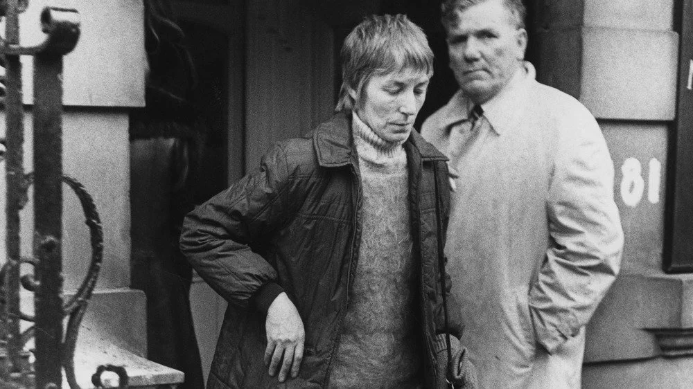 Anne Beverley leaving building