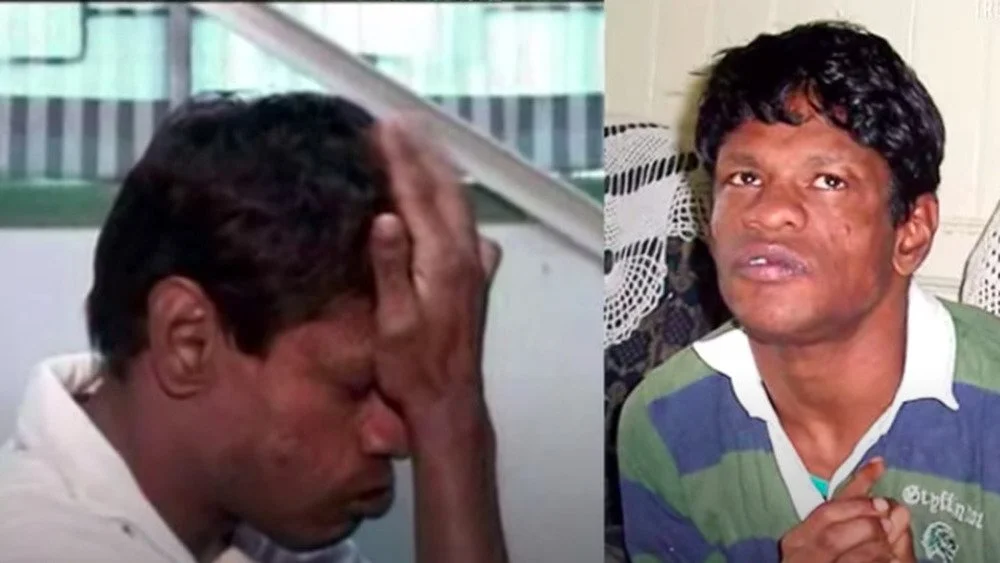 Portrait de Sujit Kumar, main sur la tête et regard vers le haut