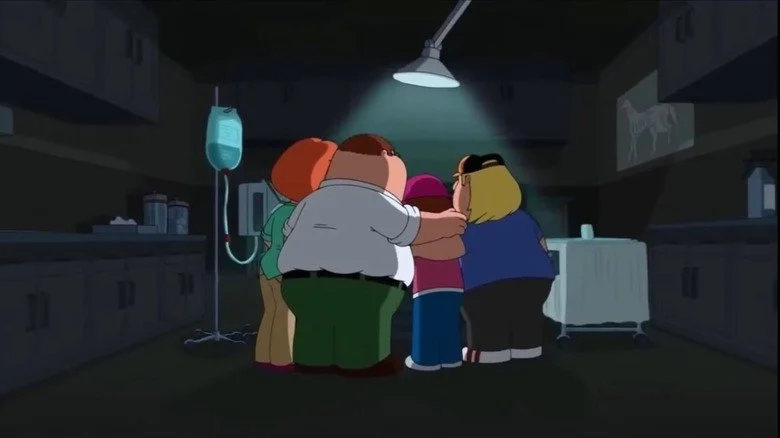 La famille Griffin autour d'une table d'opération chez le vétérinaire