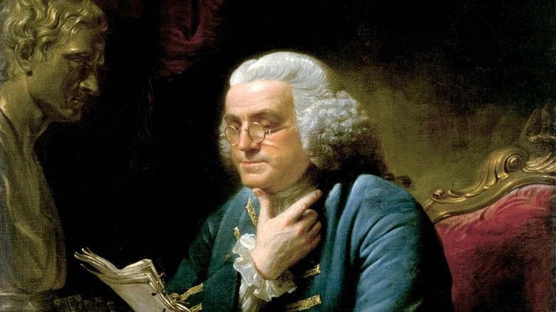 Peinture représentant Benjamin Franklin en train de lire