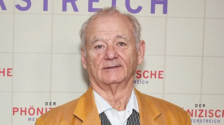 Bill Murray smirking in yellow jacket