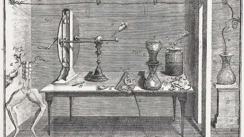 Illustration de l'équipement expérimental de Luigi Galvani avec des pattes de grenouille sur une table
